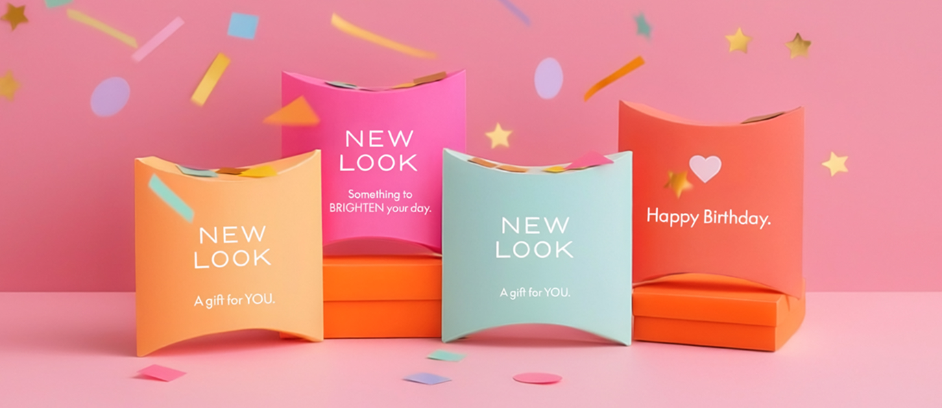A hand displays four colourful gifts cards featuring the words "New Look" prominently.