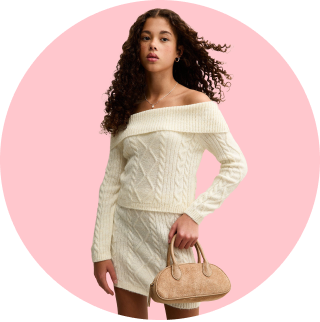 A young girl in white top and skirt.