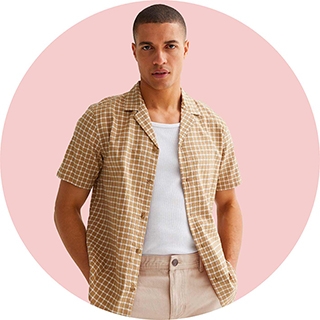 Man wears Stone Check Textured Revere Collar Shirt over a white t-shirt 