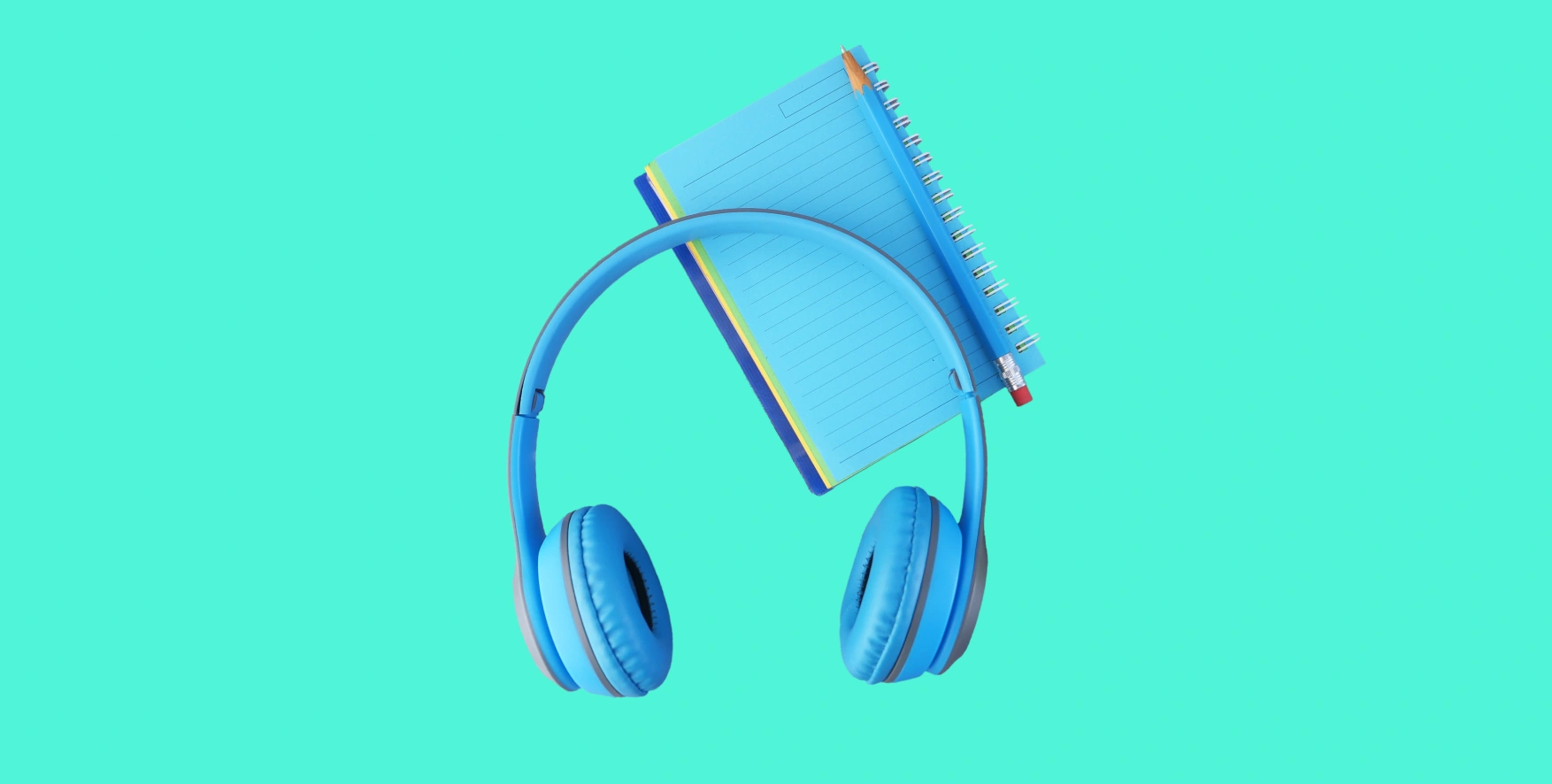 headphones and notepad with pencil
