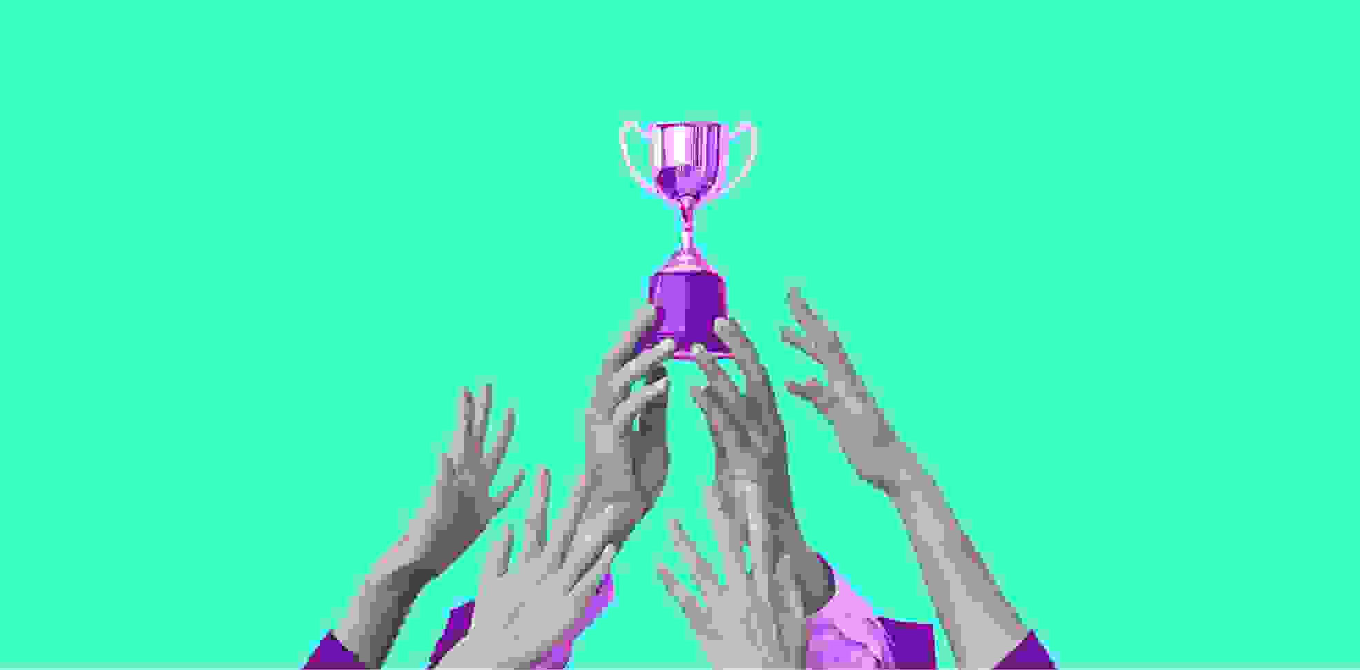 hands holding the winner's cup on green background