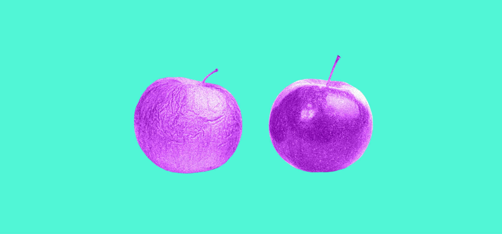 two apples on green background