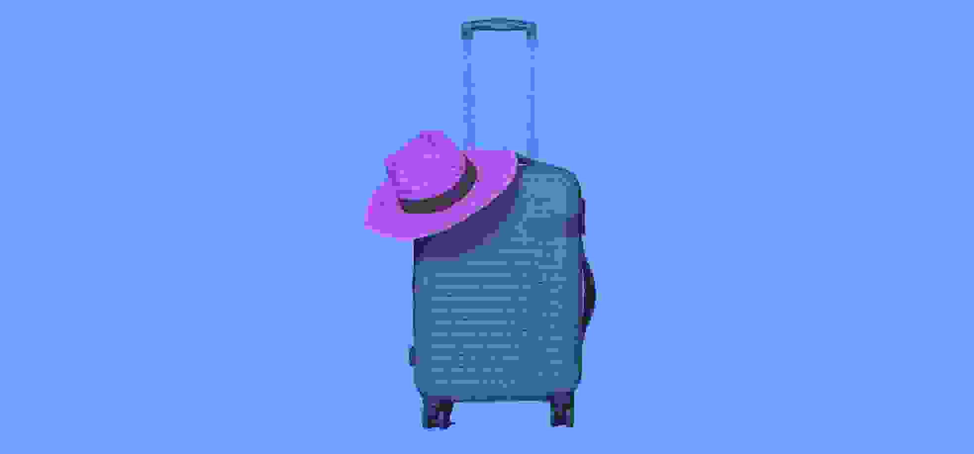 un sombrero de paja yace sobre una maleta