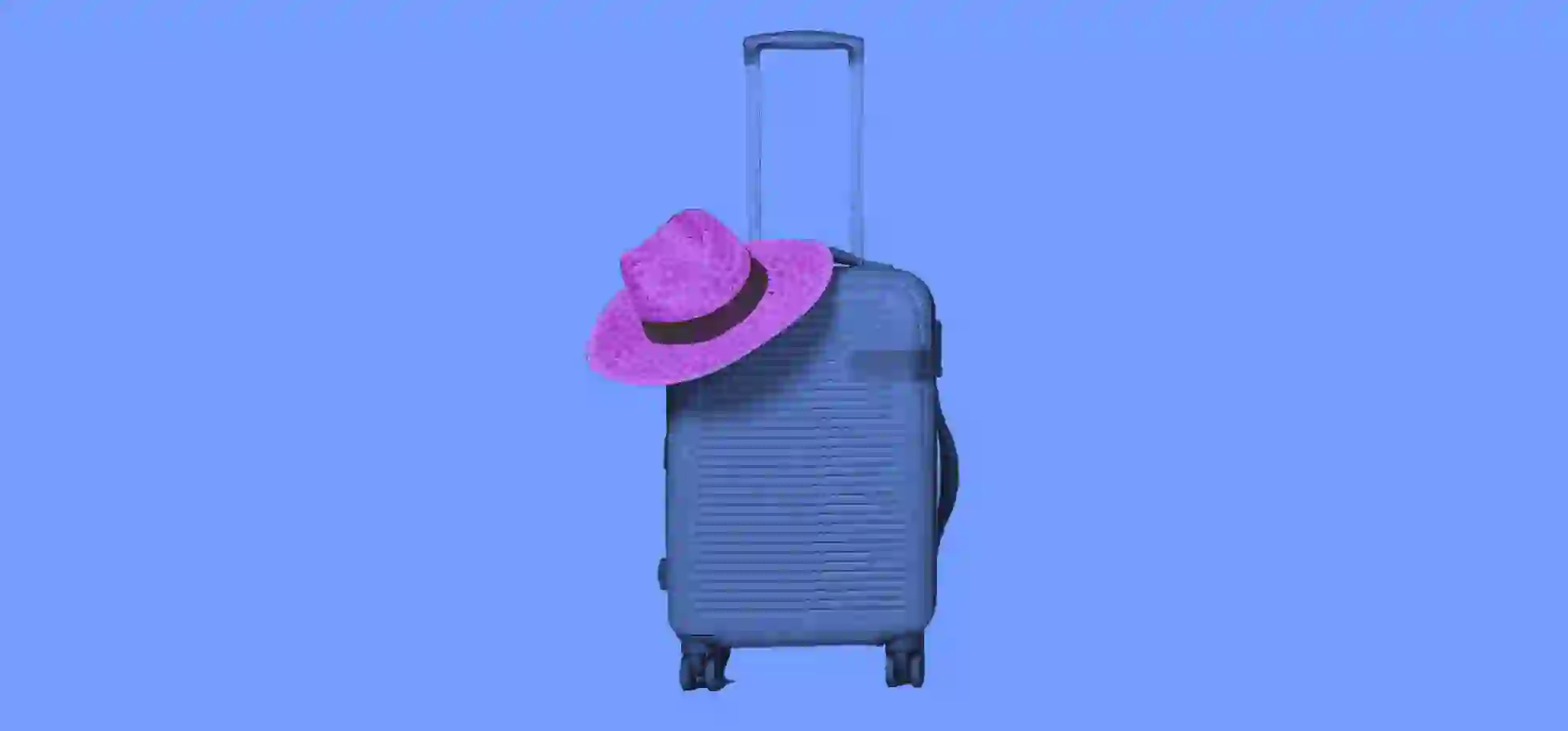 a straw hat lies on a suitcase