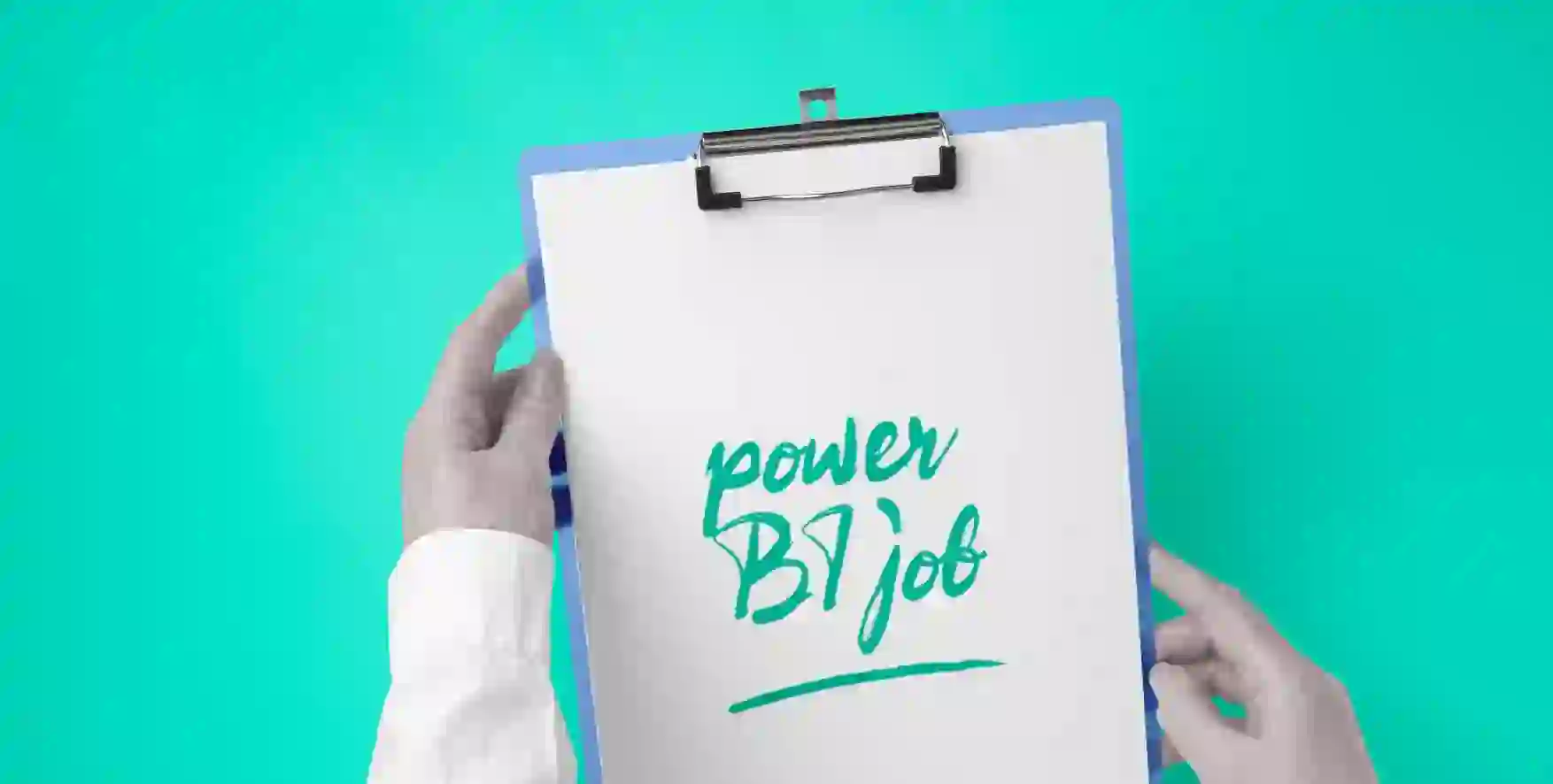 Power BI job written on a piece of paper in a clipboard