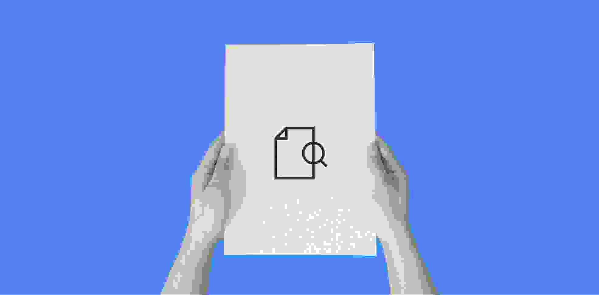 hands holding a sheet of paper with an icon, on a blue background