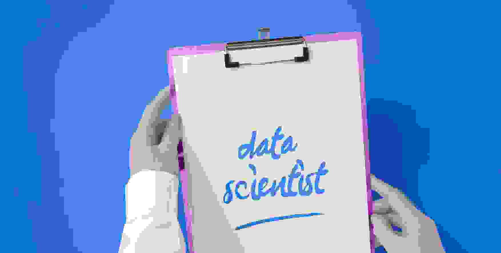data scientist written on a piece of paper in a clipboard