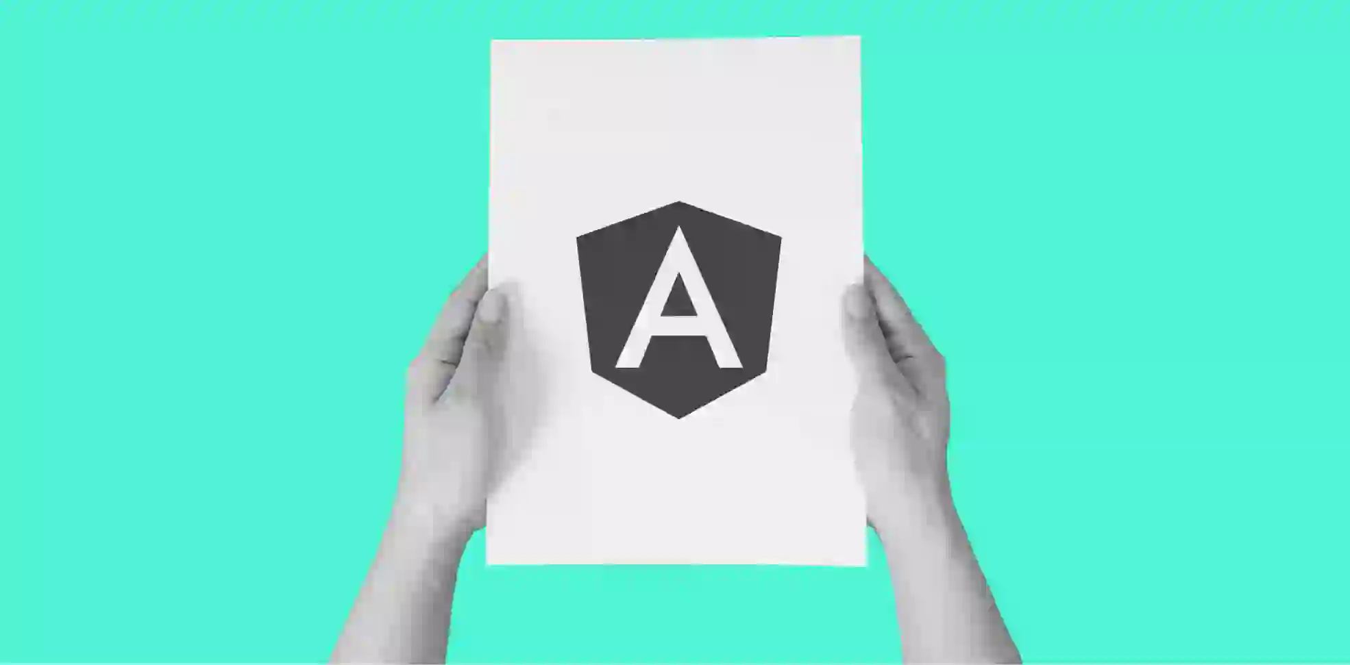 hands holding a sheet of paper with an Angular logo on green background