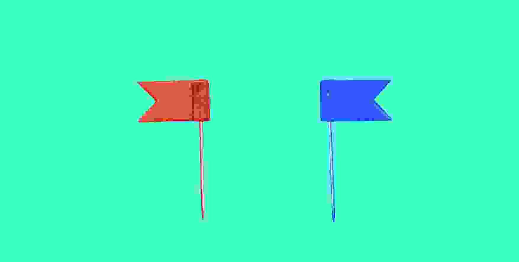 red flag and blue flag on green background