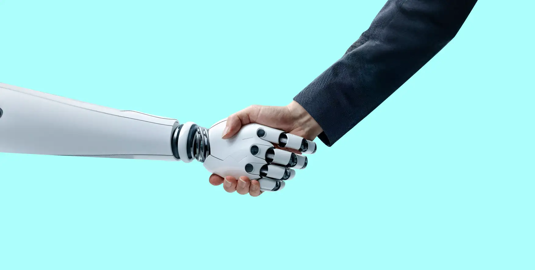 a robot hand shaking a human hand