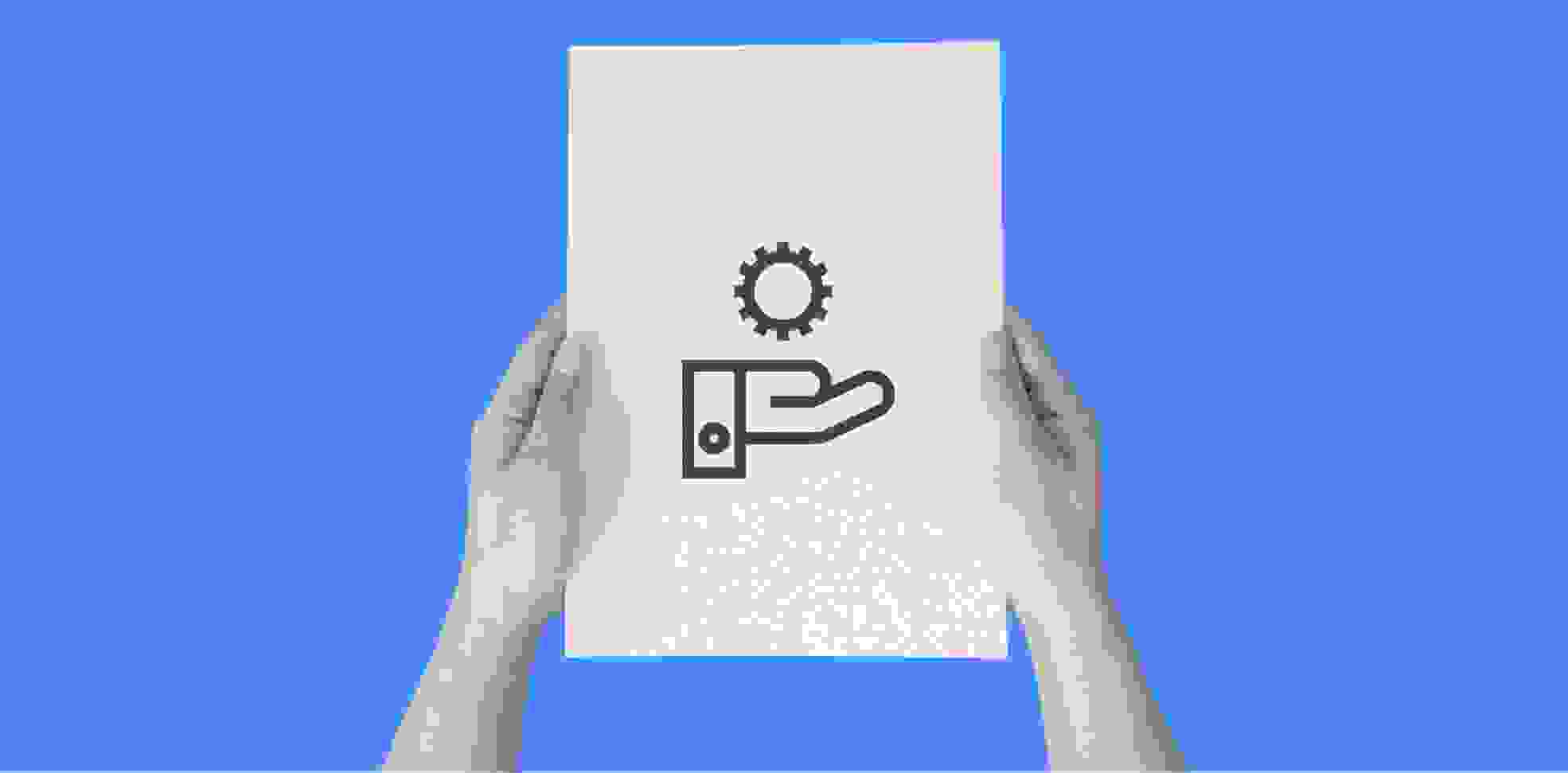 hands holding a sheet of paper with a hand's silhouette on blue background