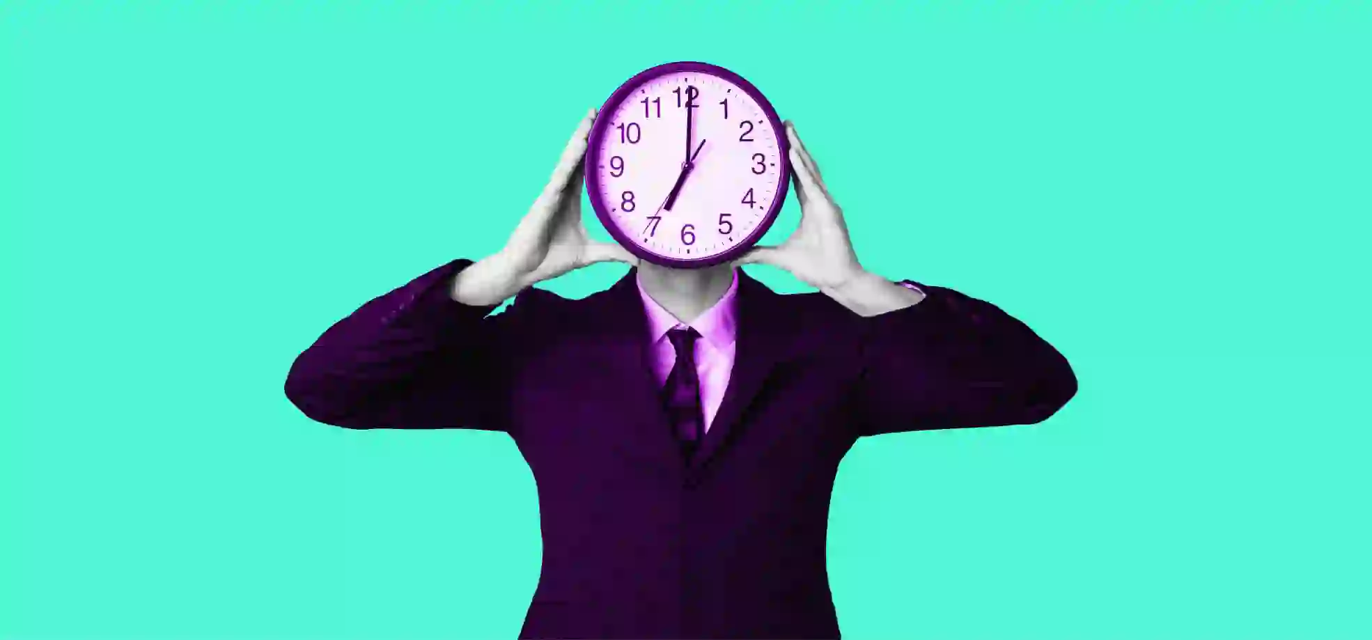 a man holding a clock in front of his face