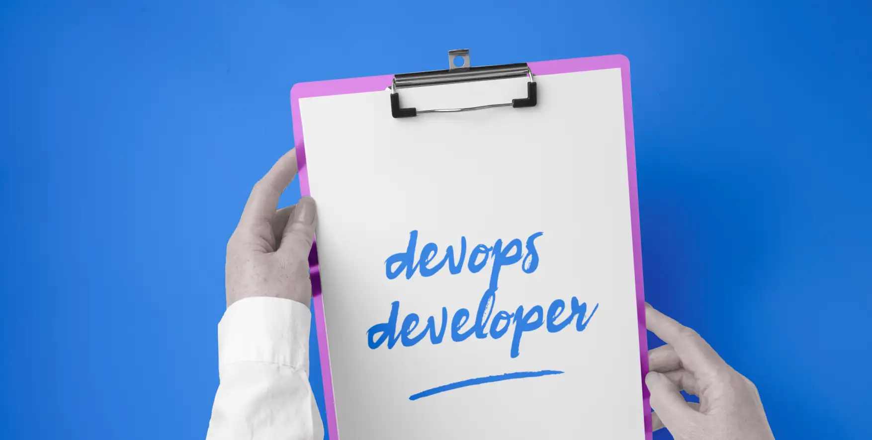 devops developer written on a piece of paper in a clipboard