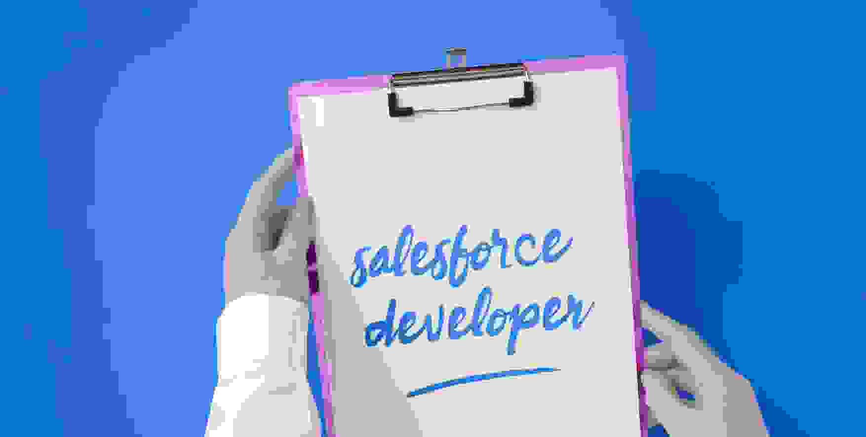 Salesforce developer written on a piece of paper in a clipboard