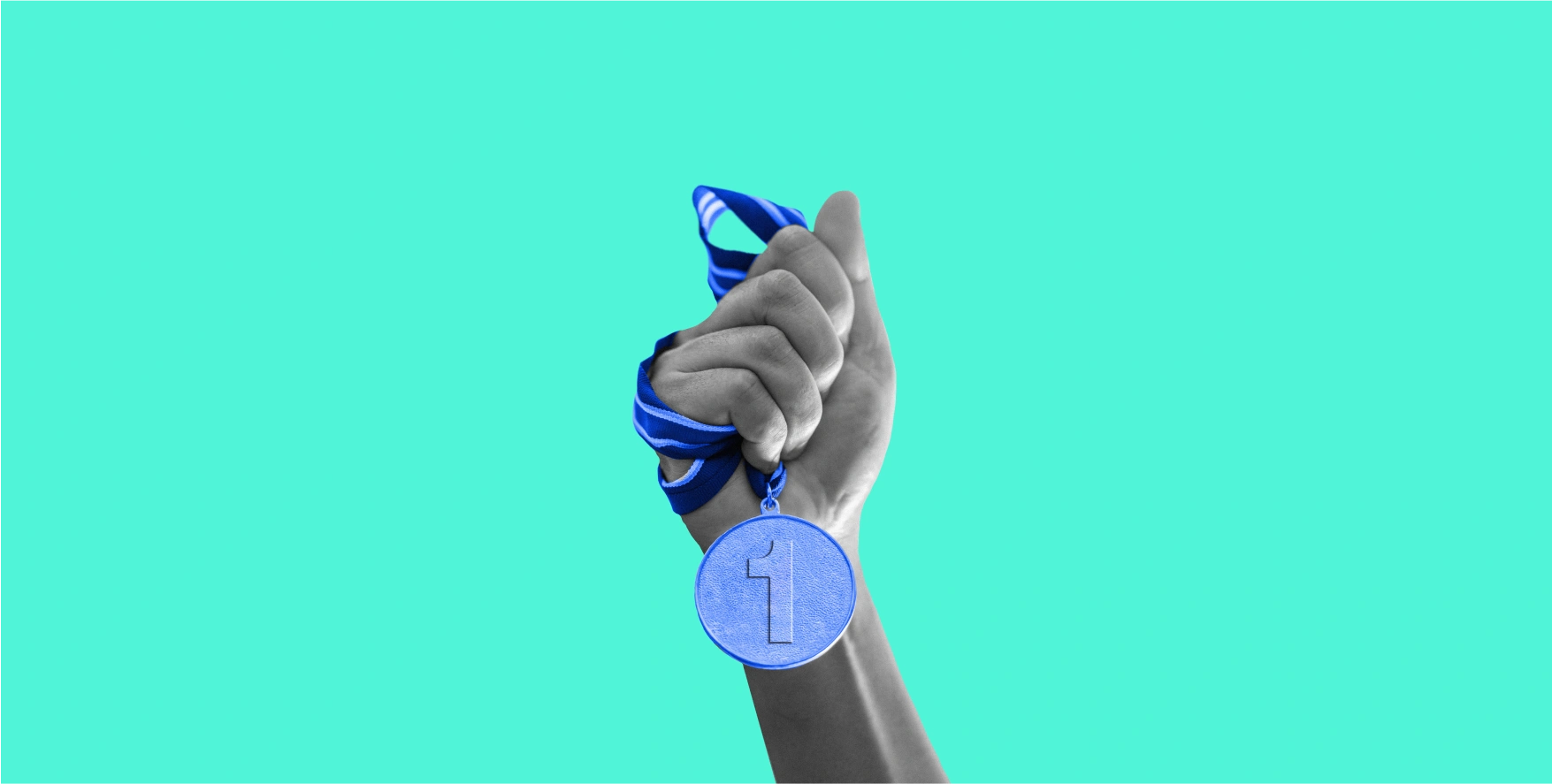 a hand holding a medal on blue background