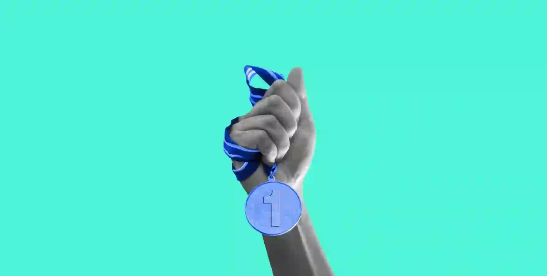 a hand holding a medal on blue background