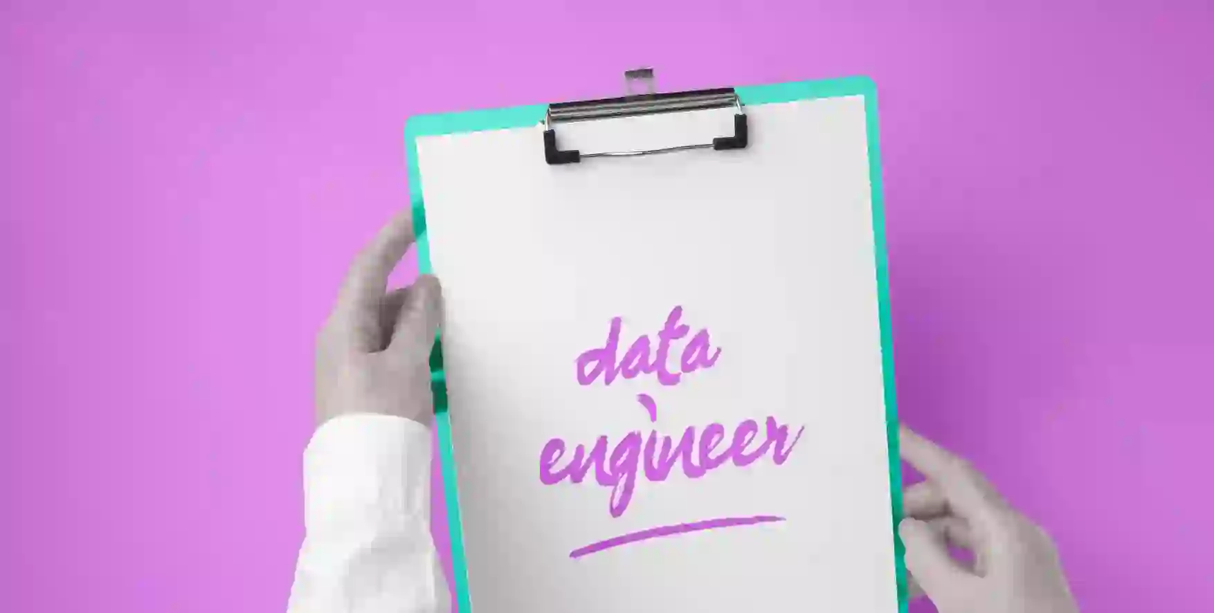 data engineer written on a piece of paper in a clipboard