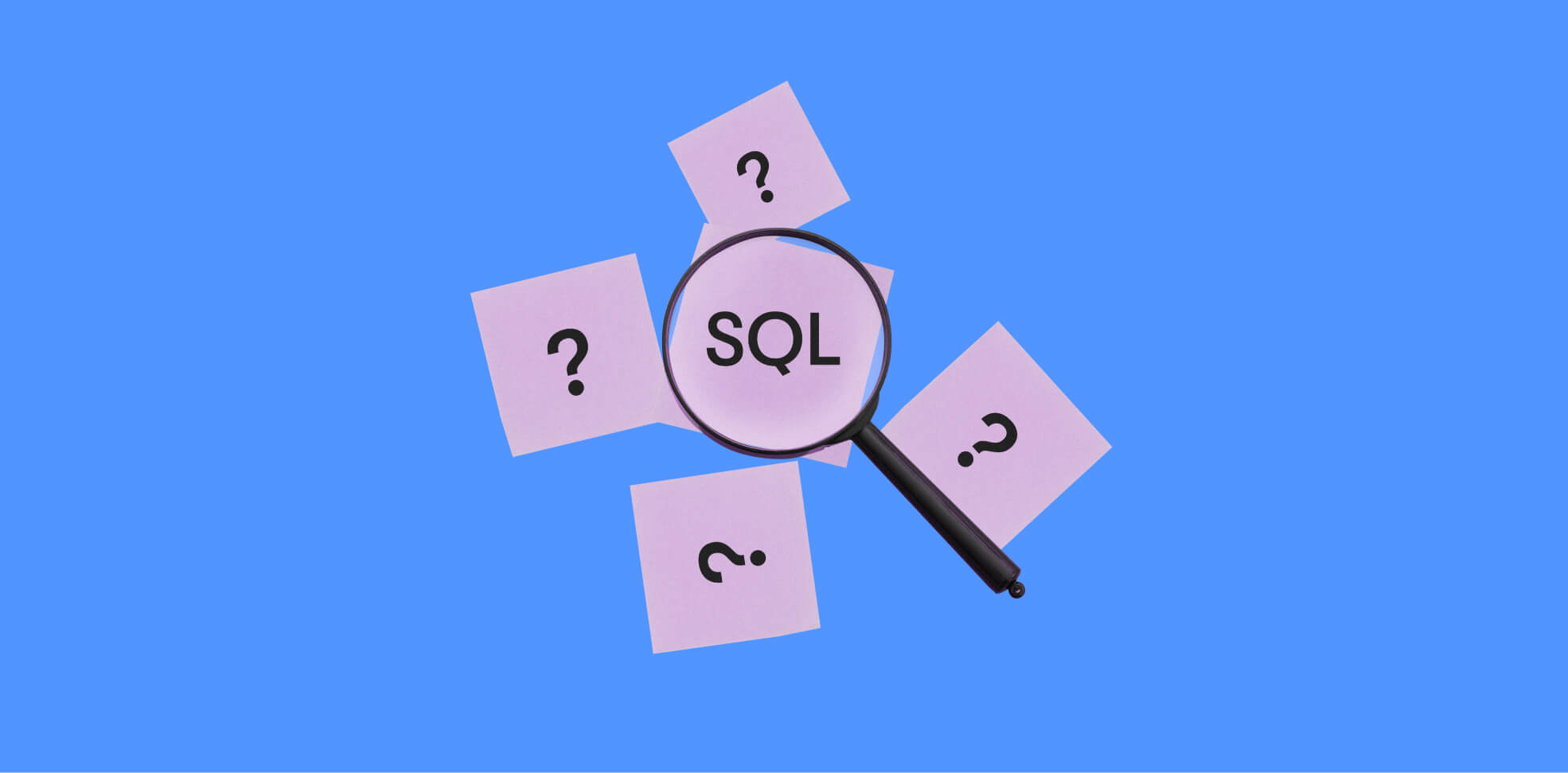 tarjetas con símbolos de preguntas y SQL bajo una lupa