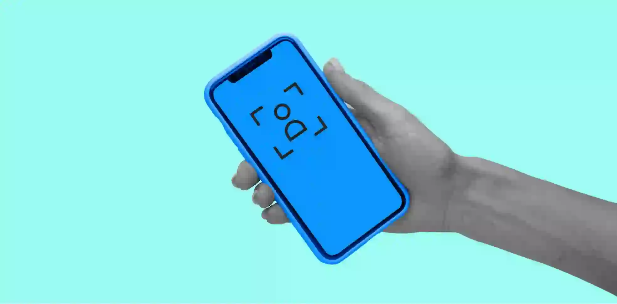 a smartphone in a hand on aqua background