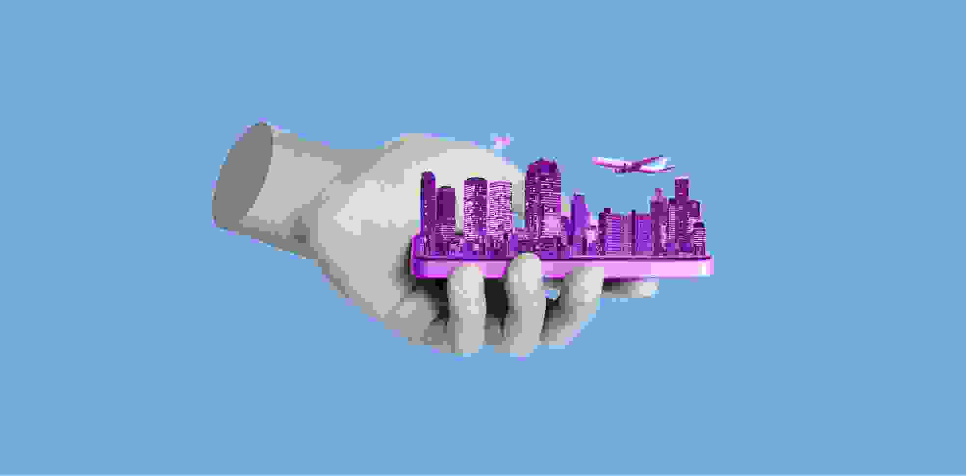 figurine of the city in hand on a blue background