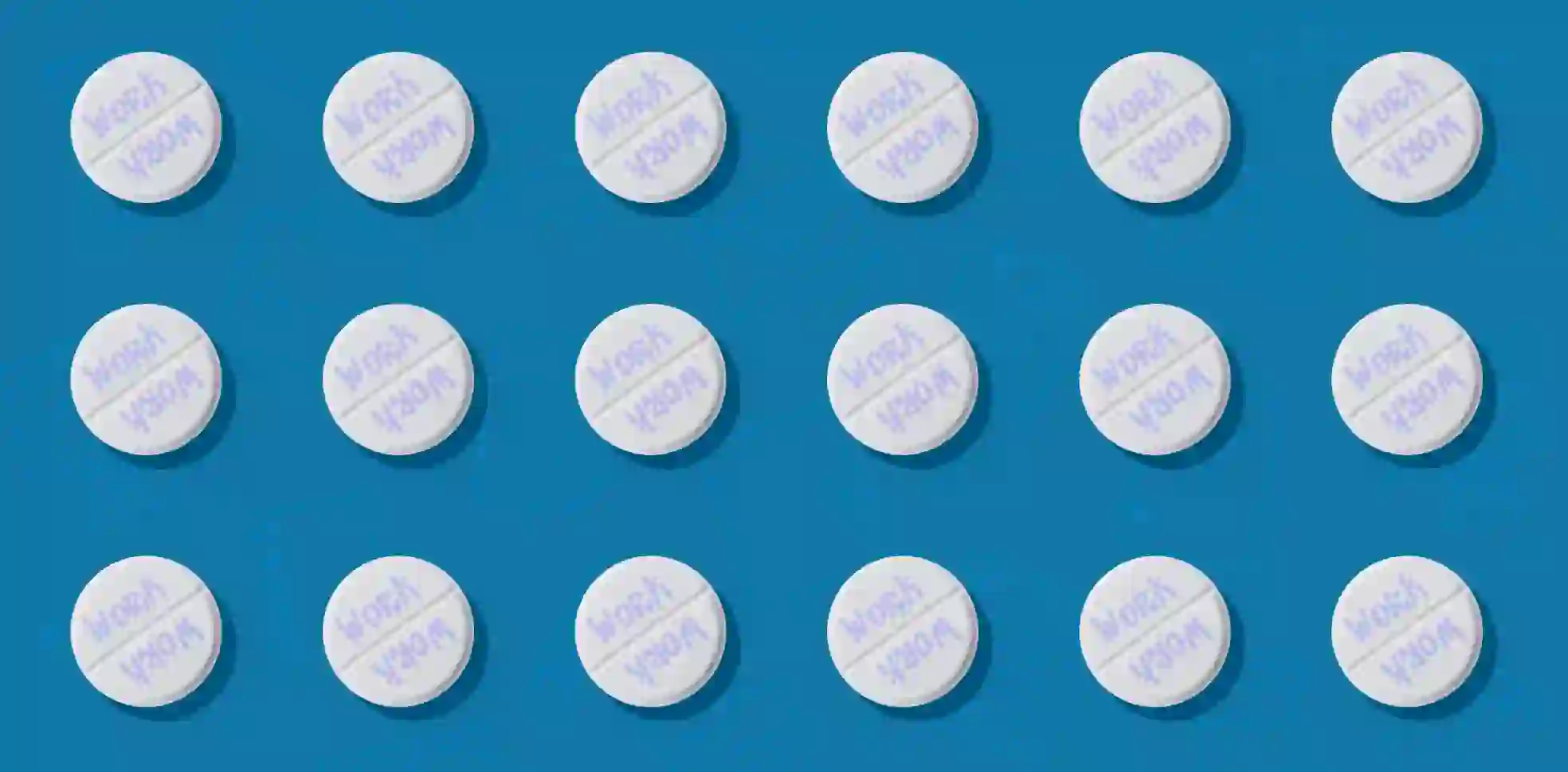 Rows of pills symbolizing work addiction