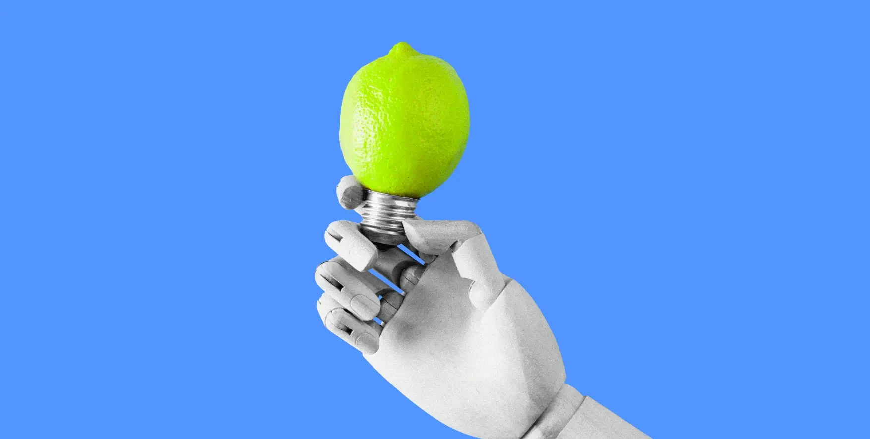 a robot hand holding a light bulb in the shape of a lemon