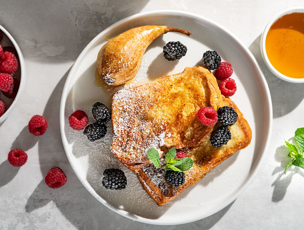 French toast with glazed pear and berries