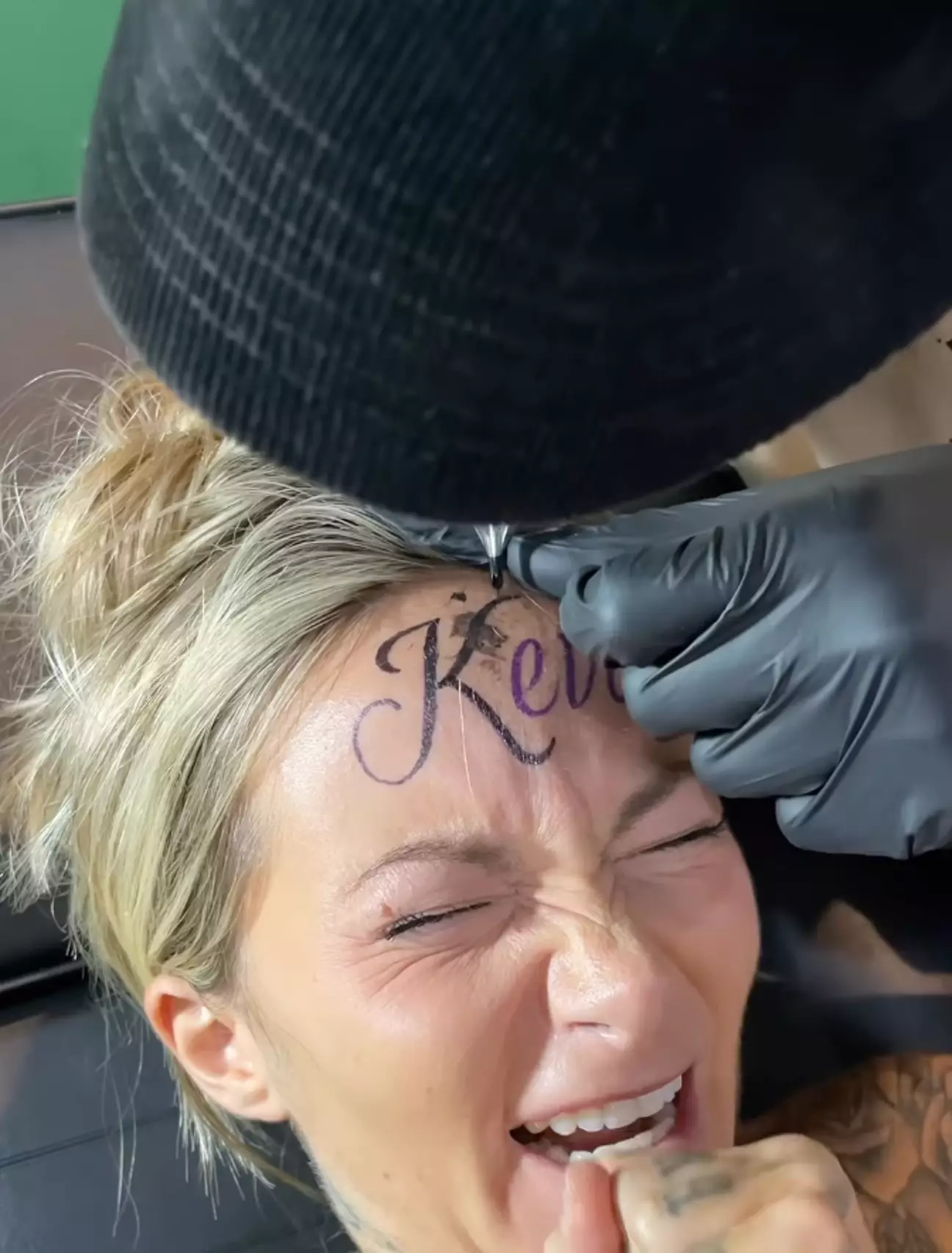 Influencer insists tattoo of boyfriend's name on her forehead is real