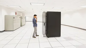 business person working in a server room.png business person working in a server room.png