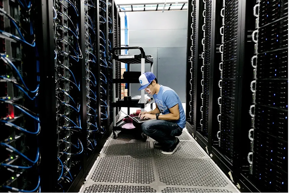 A Dropbox engineer working in one of the company's data centers A Dropbox engineer working in one of the company's data centers