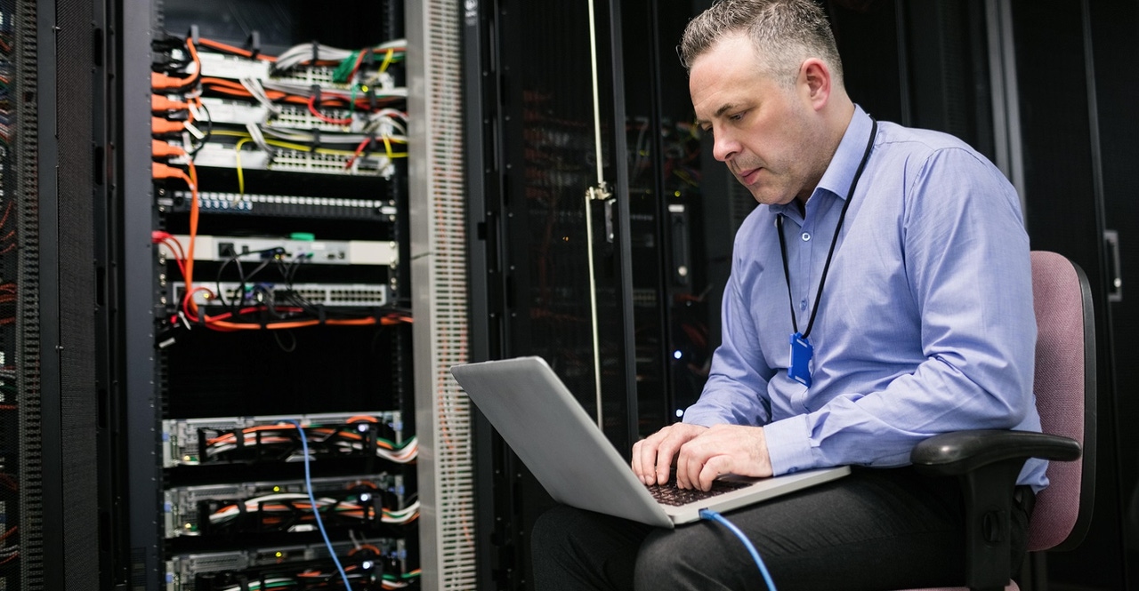 technician working in a server room technician working in a server room