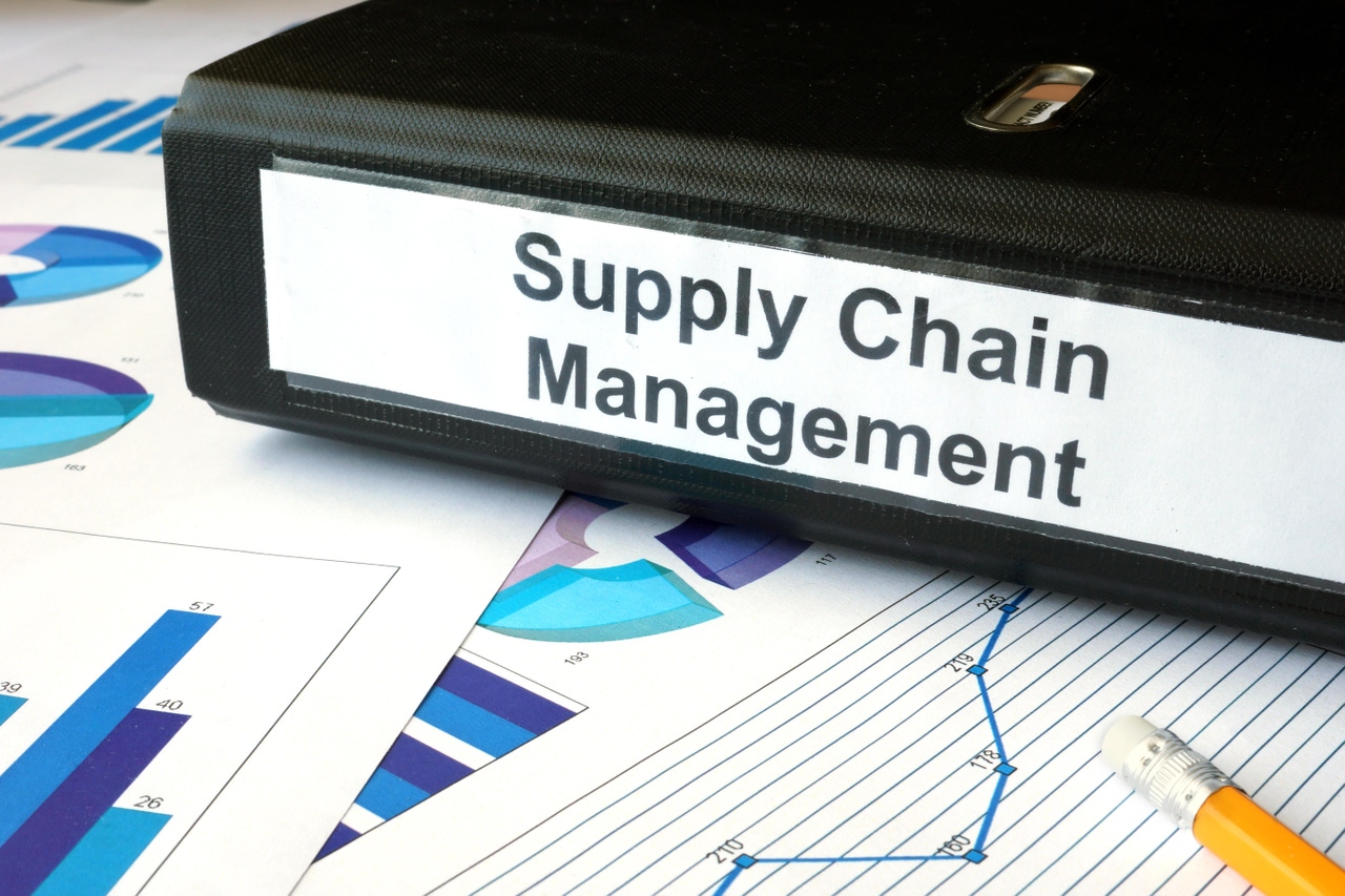 Graphs and file folder with label supply chain management. Graphs and file folder with label supply chain management.