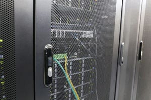Electronic security lock on sever rack in data center.
