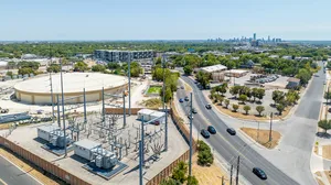 an aerial view of an Austin Energy-owned electrical substation next to the North Austin reservoir. an aerial view of an Austin Energy-owned electrical substation next to the North Austin reservoir.
