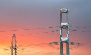 High voltage power transmission line on sunset background