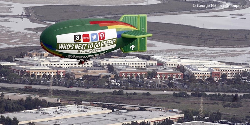 The Greenpeace Airship A.E. Bates flies over Silicon Valley in 2014 with a banner asking "Who's The Next To Go Green?"
