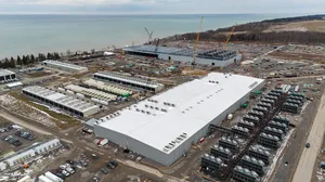 Aerial view of a redeveloped industrial campus with data halls and infrastructure Aerial view of a redeveloped industrial campus with data halls and infrastructure