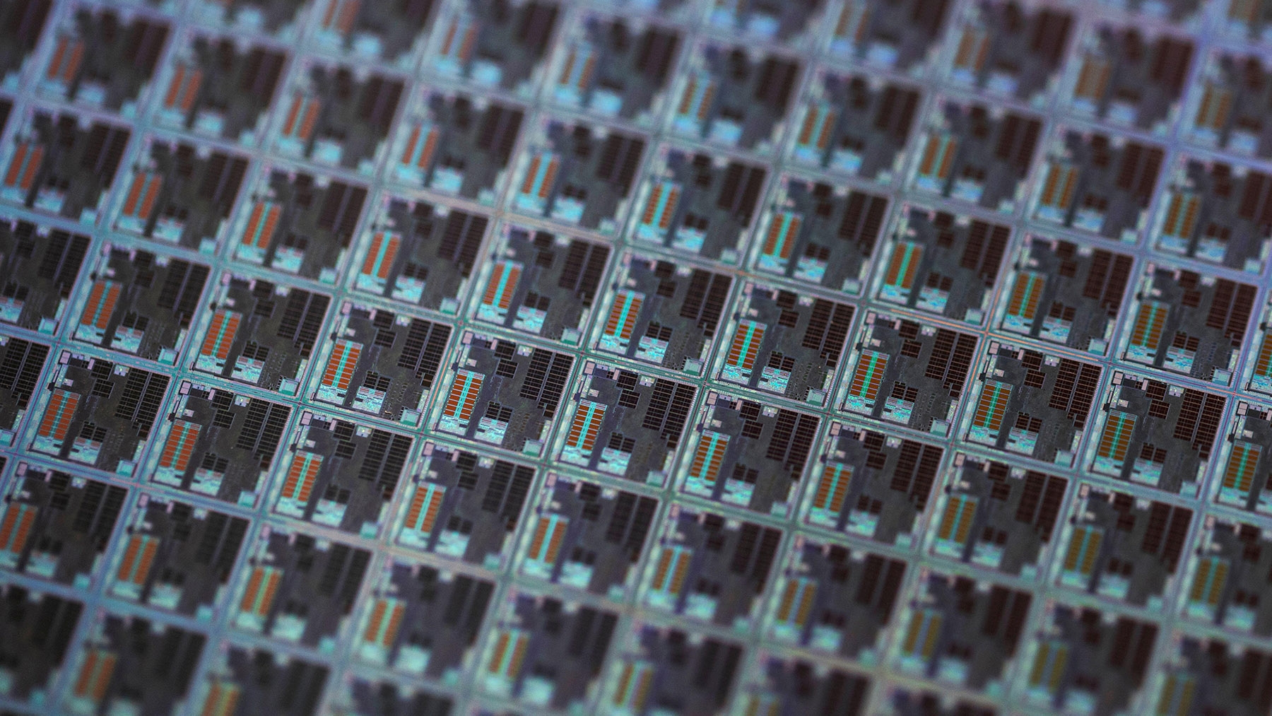 Macro view of semiconductor wafer showing integrated circuit chip layout and microstructure