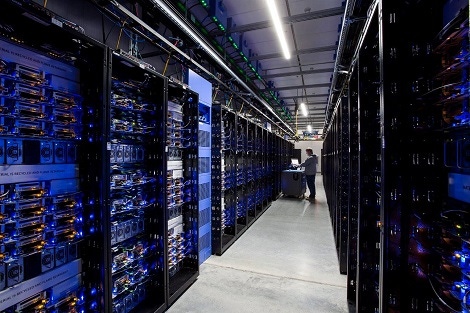 A technician at work in a data hall at Facebook’s Altoona, Iowa, data center.