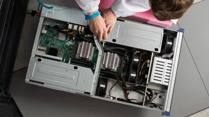 IT Engineer Servicing Part of a Supercomputer IT Engineer Servicing Part of a Supercomputer