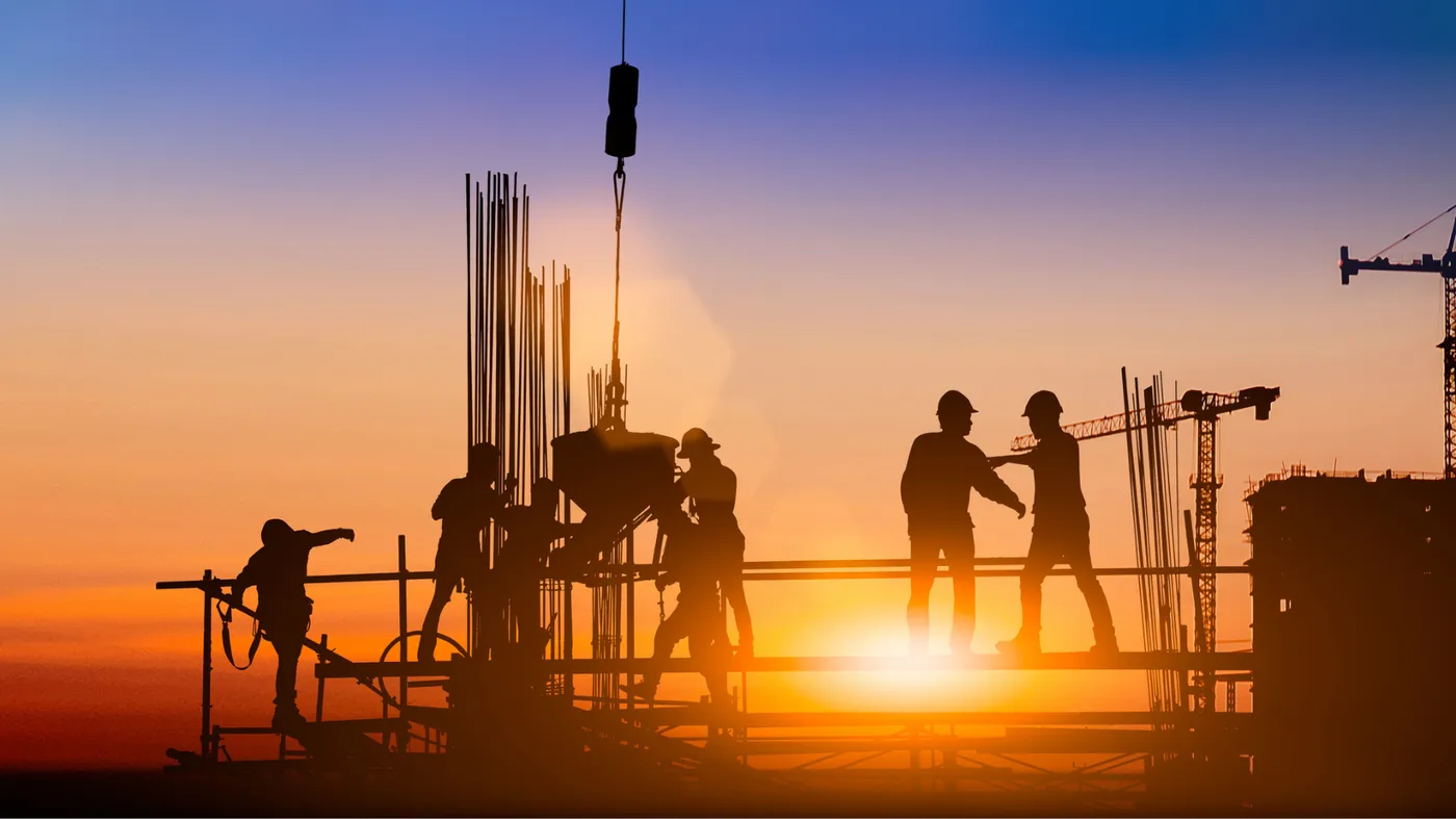 Silhouette of engineer and construction team working at site Silhouette of engineer and construction team working at site