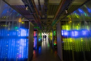 image of the inside of a data center with blue lighting