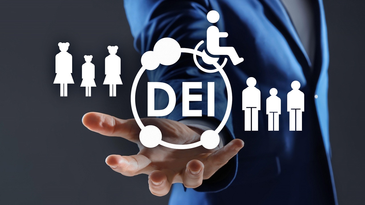 Businessman showing virtual image of people and person with disability with the DEI abbreviation Businessman showing virtual image of people and person with disability with the DEI abbreviation
