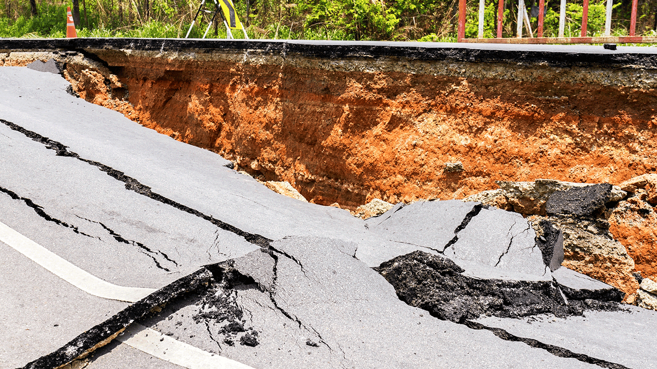 Broken road and ditch Broken road and ditch