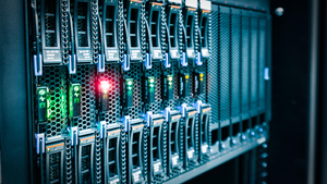 Computer Server mount on rack in data center room with red lighting alarm Computer Server mount on rack in data center room with red lighting alarm