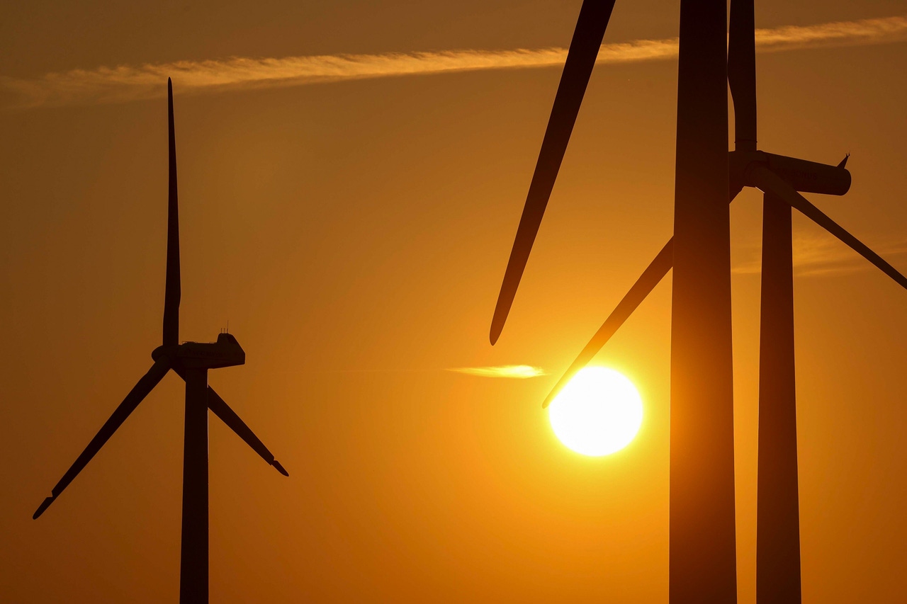 wind turbines at sunset wind turbines at sunset