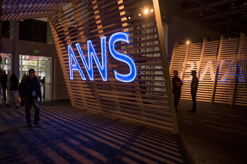 blue lit up AWS logo at event