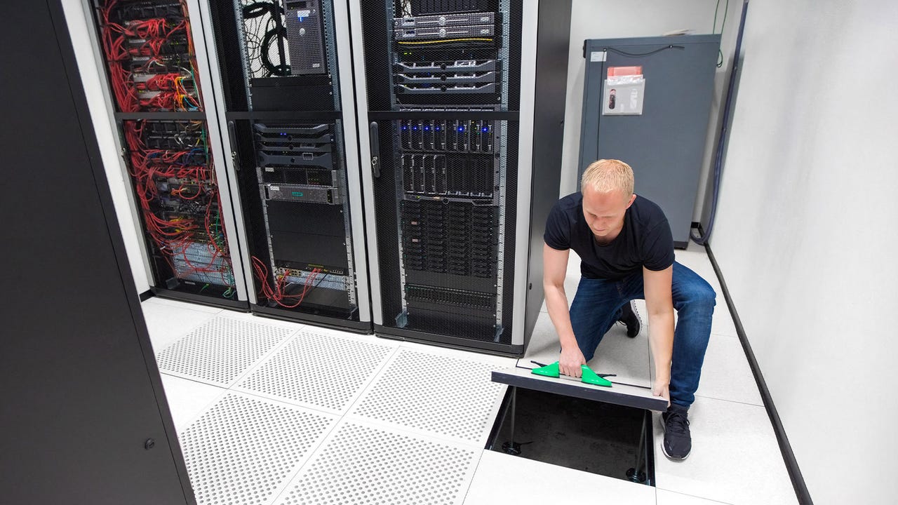 Data center technician maintaining a facility Data center technician maintaining a facility