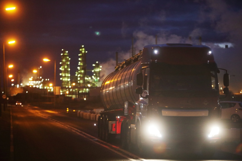 Truck carrying oil leaving refinery