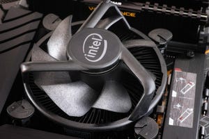 An Intel CPU fan installed onto an Intel i5 CPU. Close up.